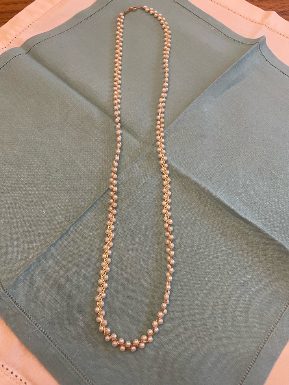 Pearl and gold tone necklace